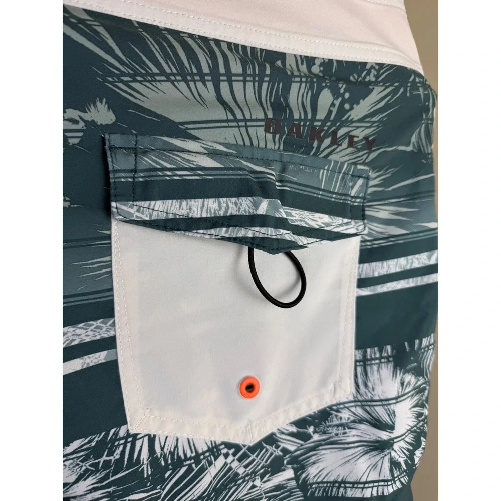 Oakley Mens Board Shorts Teal Green Tropical Palm Stripe Swim Trunks sz 36 Beach